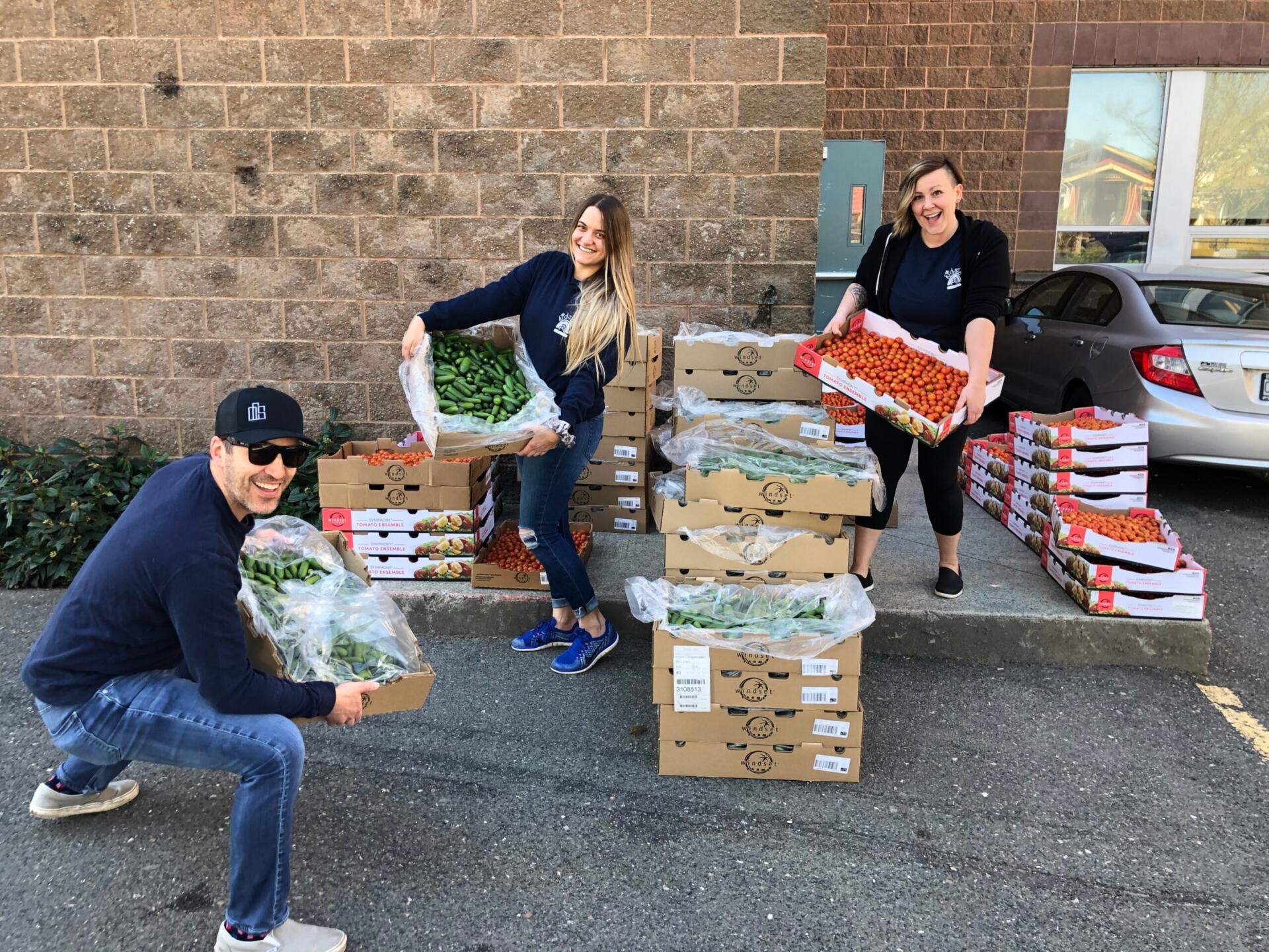 Vancouver food runners volunteers picking up fresh produce to redistribute it to local charities donating food to the food insecure